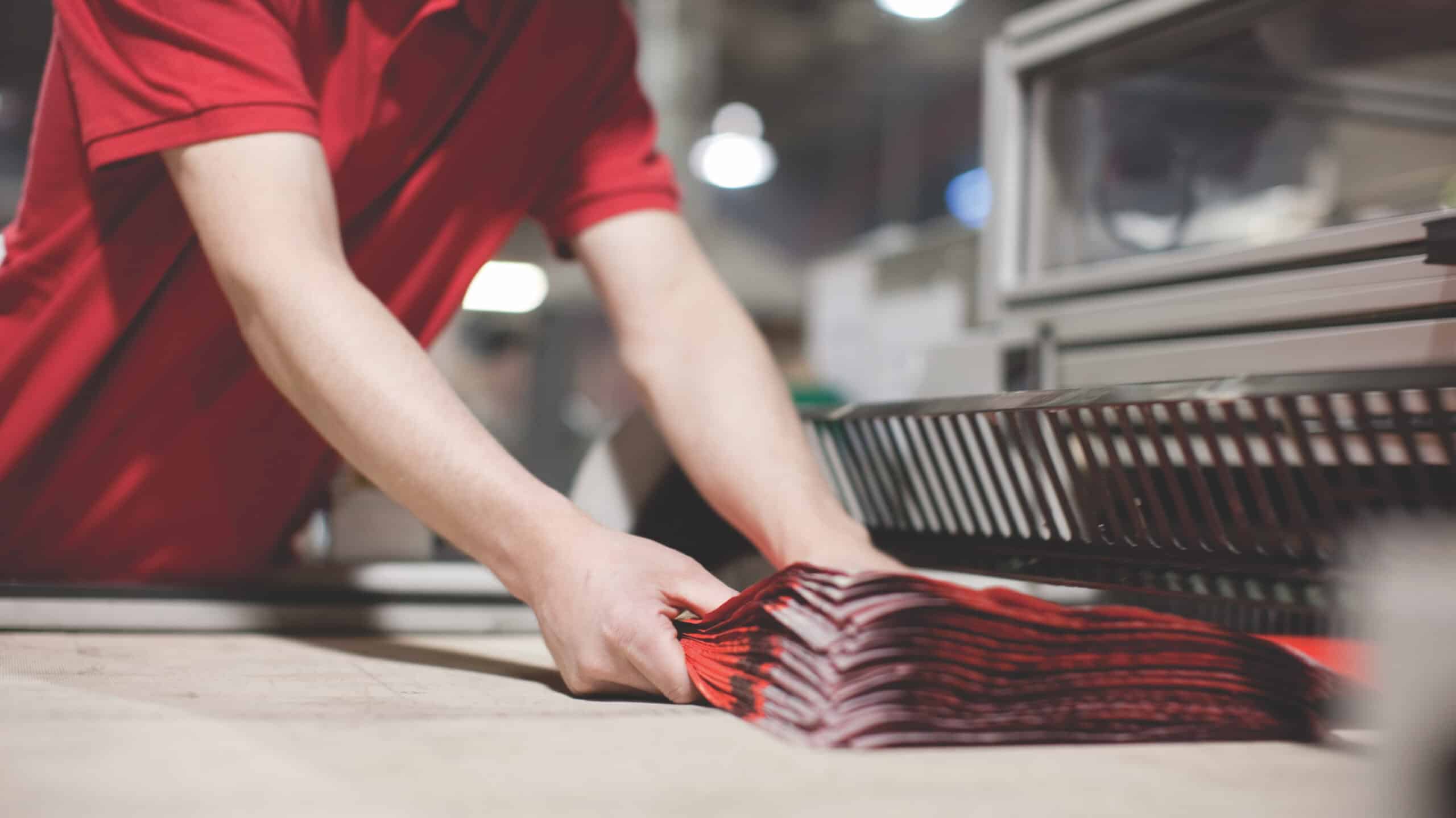 Duo Packaging branded mailing bags coming off a machine