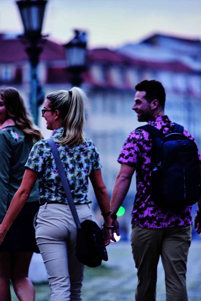 Craghoppers people walking holding hands in a city