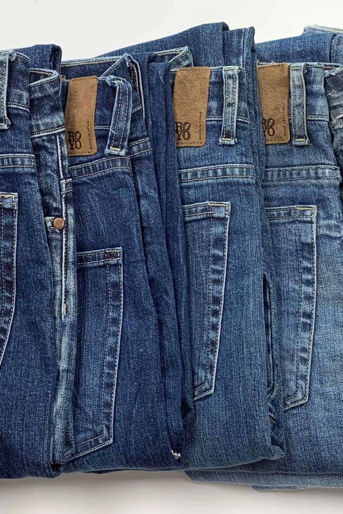 Tejidos Royo line of folded jeans in different shades of blue